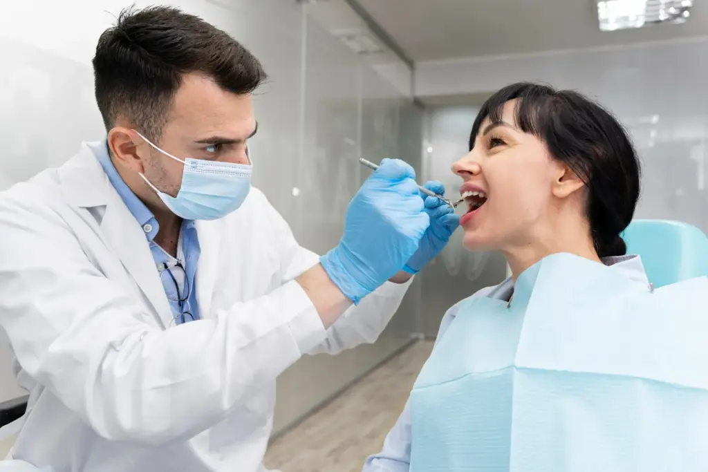 Dentist carrying out a routine dental examination in a modern clinic.
