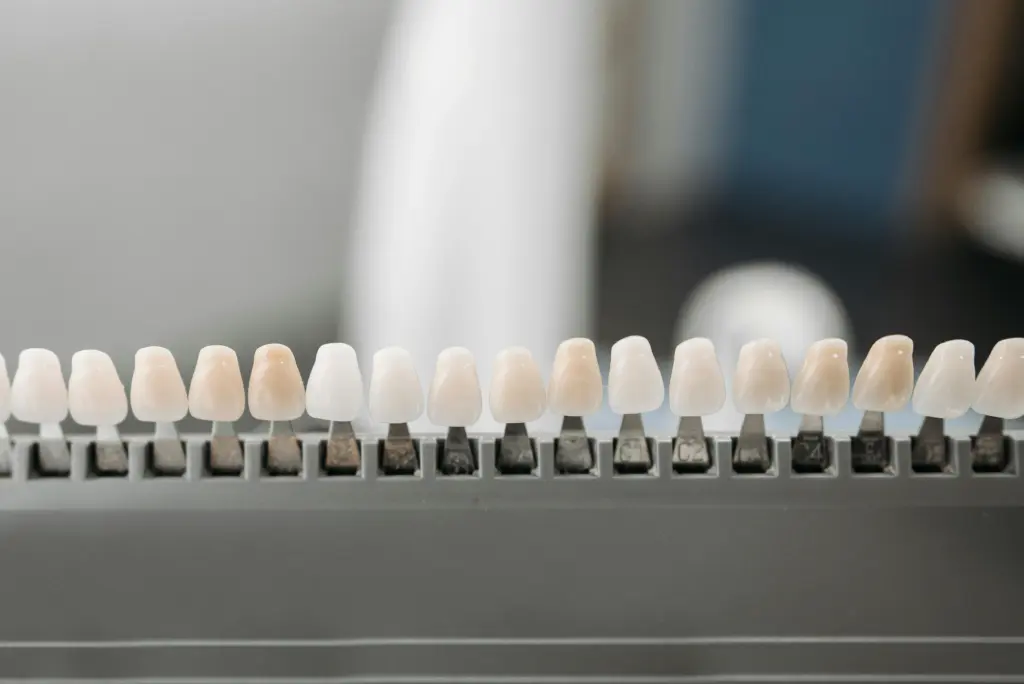 Dental veneer shade guide used during smile planning.
